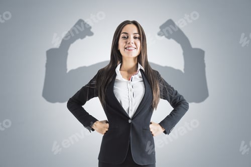 Preview: Portrait Of Attractive Young European Businesswoman With Hands On Sides And Smile, Shadow Muscle