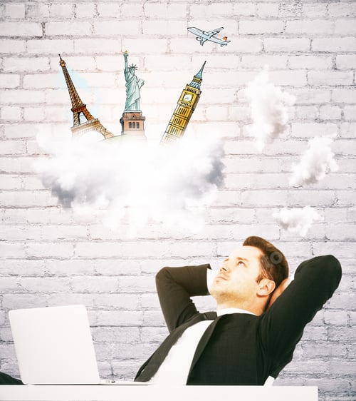 Preview: Relaxing Young Business Man At Workplace Dreaming About Holidays On White Brick Wall Backgroud