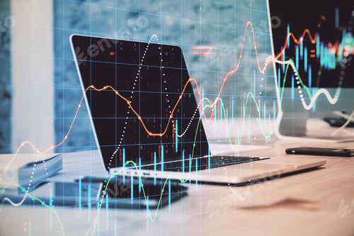 Preview: Laptop Computer On Desktop With Stock Charts Interface. Trade And Financial Growth Concept. Close Up