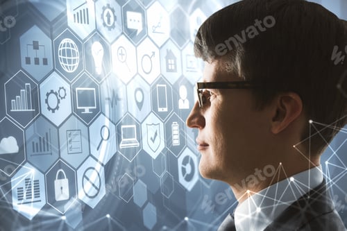 Preview: Side View Of Handsome Young European Businessman Looking At Glowing Business Interface On Blurry