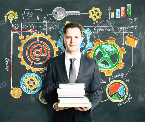 Preview: Businessman Holding A Pack Of Books With Blackboard With Business Strategy Concept On The Background
