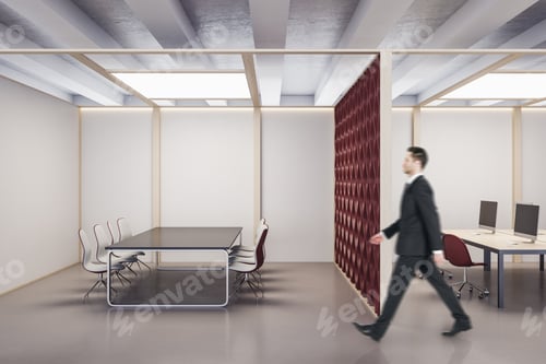 Preview: Businessman Walking In Contemporary Office Interior With Computers And Meeting Table. Workplace And