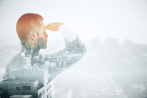 Preview: Young Businessman Looking Into The Distance On City Background With Copyspace. Research Concept