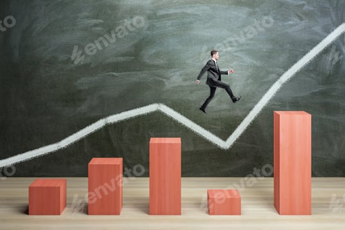 Preview: Businessman Jumping On Red Chart Bars On Chalkboard Wall Background. Crisis, Business And Growth