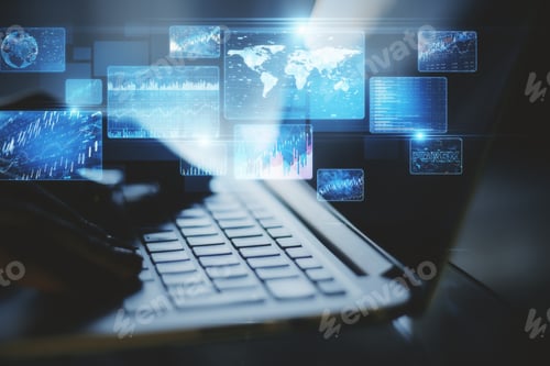 Preview: Hand Using Laptop On Desktop With Abstract Business Interface Hologram On Blurry Background