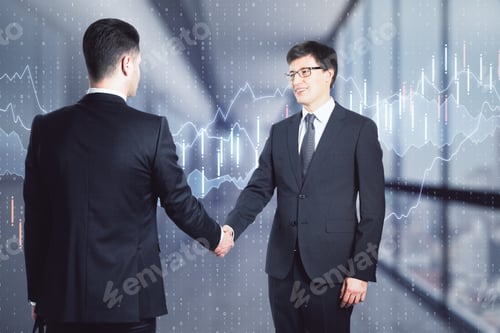 Preview: Two Businessmen Shaking Hands And Making A Deal In An Office Corridor With Trading Charts In The