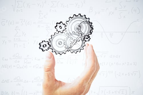 Preview: Human Hand And Painted Gears At Equations Background