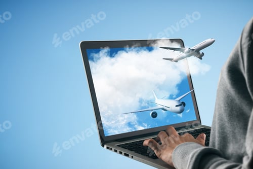 Preview: Planes Takes Off Among Clouds From Laptop Monitor In Human Hands At Blue Background
