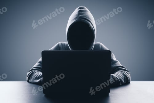 Preview: Man With Hood Using Laptop On Gray Background. Hacker And Virus Concept. Copy Space