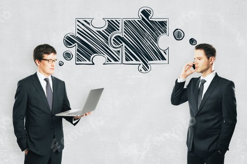 Preview: Businessmen With Puzzle Pieces On Concrete Wall Background. Teamwork And Partnership Concept