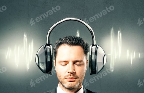 Preview: Portrait Of Handsome Businessman With Drawn Headphones And Sound Wave On Textured Concrete