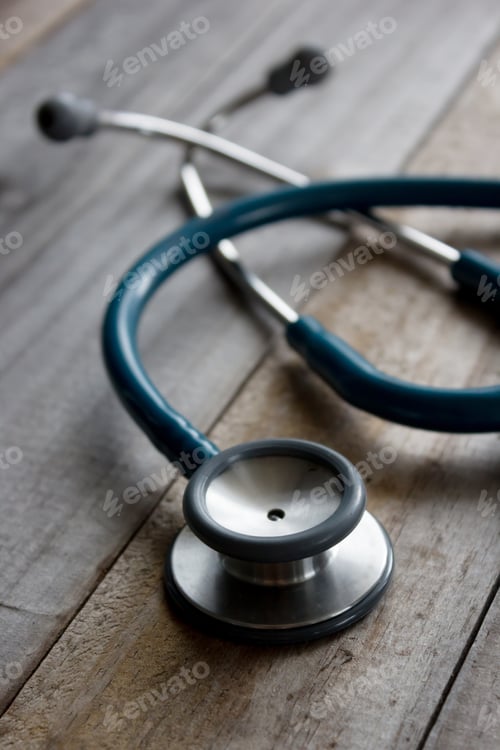 Preview: Close Up Of Old Stethoscope On Wooden Table