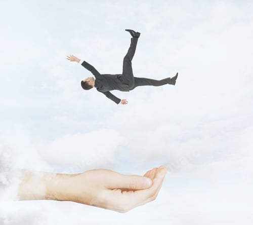 Preview: Hand Ready To Catch Falling Businessman On Cloudy Sky Background. Assistance And Help Conceprt