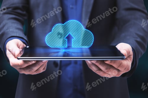 Preview: Close Up Of Businessman Hands Holding Tablet With Abstract Digital Clouds On Blue Background. Cloud