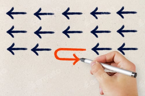 Preview: Hand Drawing Arrows On Concrete Wall Background. Leadership And Success Concept