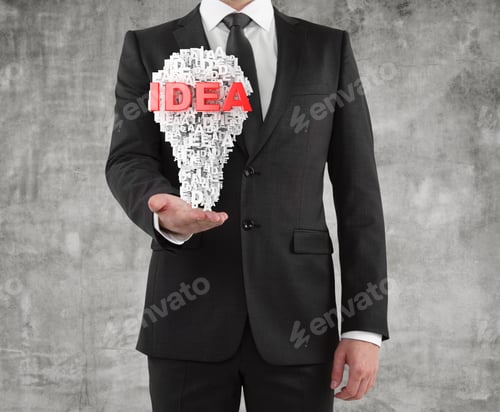 Preview: Businessman Holding A Idea Concept On Concrete Background