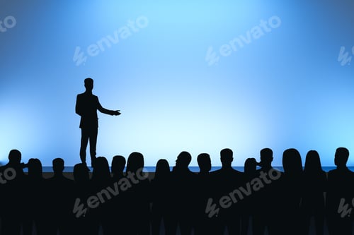 Preview: Man Giving Speech In Front Of Backlit Audience On Light Blue Background. Speaker And Leadership