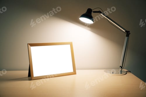 Preview: Blank Picture Frame With Lamp On Wooden Table, Mock Up