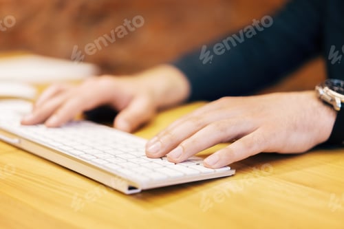 Preview: Side View Of Businessman Hands Typing On White Computer Keypad. Blurry Background. Technology And