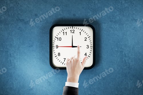 Preview: Businessman Hand Pointing At Clock Dial On Blue Wall Background. Time Management And Deadline