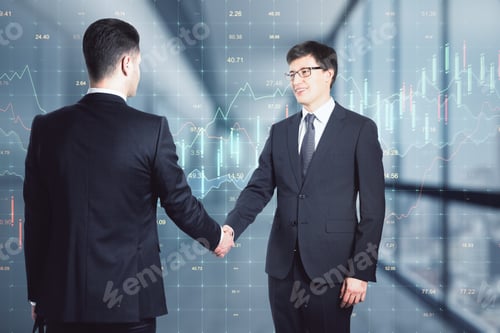 Preview: Two Businessmen Shaking Hands, Trading Charts In The Background, Agreement And Deal Concept