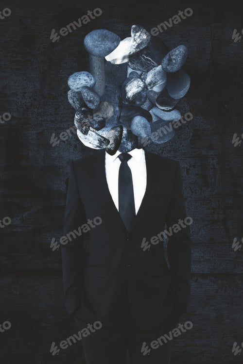 Preview: Rock Headed Businessman On Concrete Background
