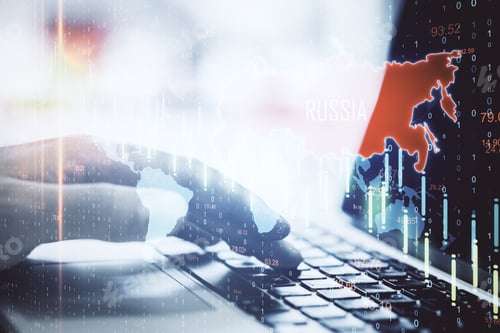 Preview: Hand Typing On Laptop With Map Of Russia And Falling Chart. Business And Financial Crisis Concept