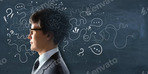 Preview: Portrait Of Attractive Young European Man On Chalkboard Wall Background With Arrows And Thought