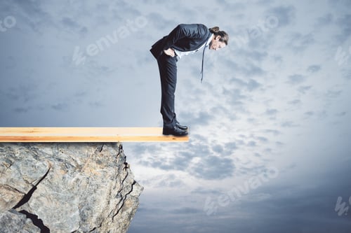 Preview: Risk And Crisis Concept. Young Businessman Looking Down From Cliff. Sky Background