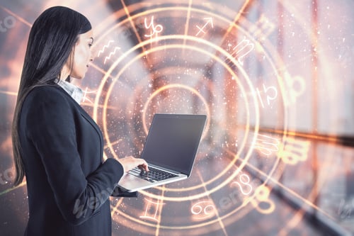 Preview: Attractive Young European Businesswoman With Laptop And Abstract Zodiac Sign Hologram On Blurry