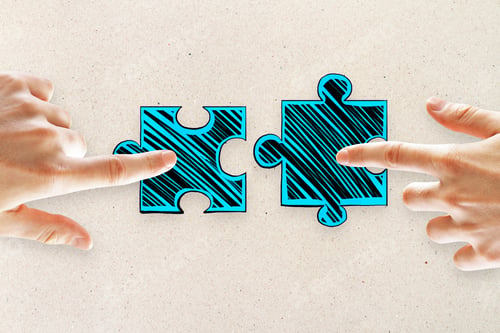 Preview: Hands With Drawn Puzzle Pieces On Concrete Background. Teamwork And Game Concept