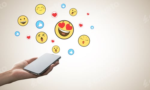 Preview: Hand Holding Cellphone With Emotive On Subtle Background. Communication And Emotion Concept