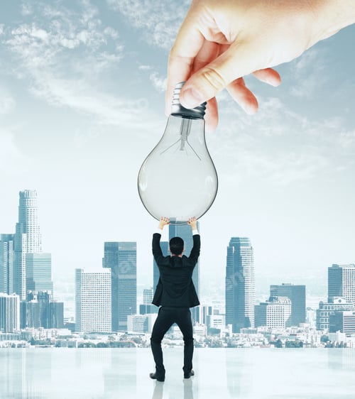 Preview: Businessman Holding Lamp On Light City Background. Power And Innovation Concept