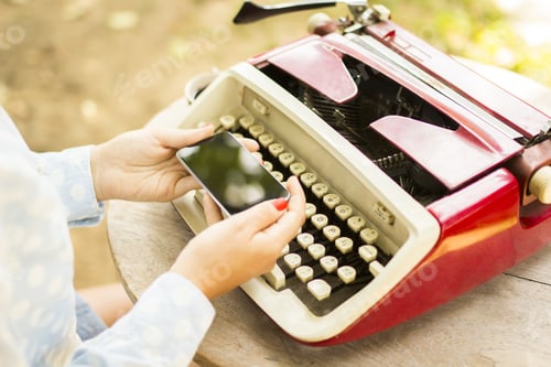 Preview: Girl With Cell Phone And Typewriter