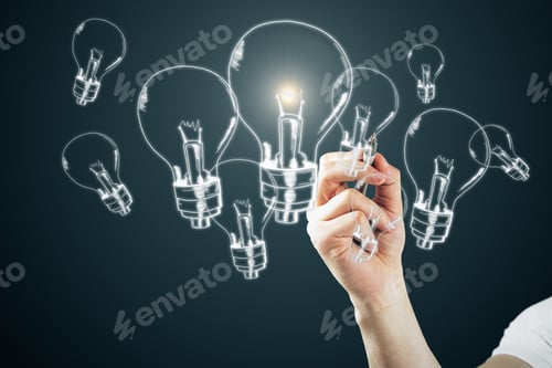 Preview: Male Hand Drawing Glowing Lamps On Dark Bakcground. Idea, Innovation And Solution Concept