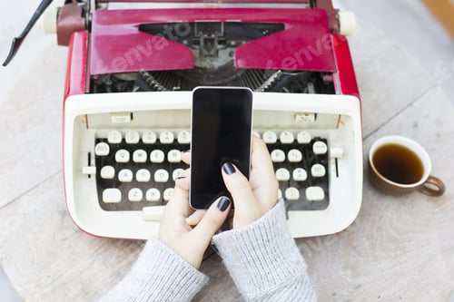Preview: Girl With Cell Phone And Typewriter