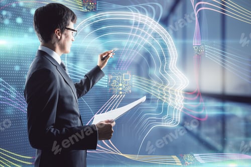 Preview: Attractive Young European Businessman Using Display In Blurry Office Interior With Glowing Head