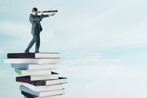 Preview: Side View Of Young Businessman With Binoculars Standing On Pile Of Books. Vision And Education