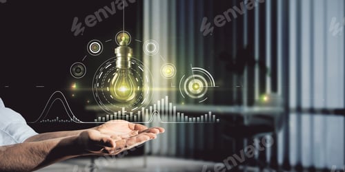 Preview: Close Up Of Hand Holding Creative Business Chart With Abstract Glolwing Light Bulb On Blurry