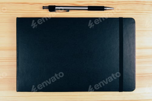 Preview: Blank Black Diary Cover And Pen On Wooden Table, Mock Up
