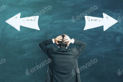 Preview: Choosing Between Two Solutions With Businessman Grabbing His Head Looking At Blackboard With