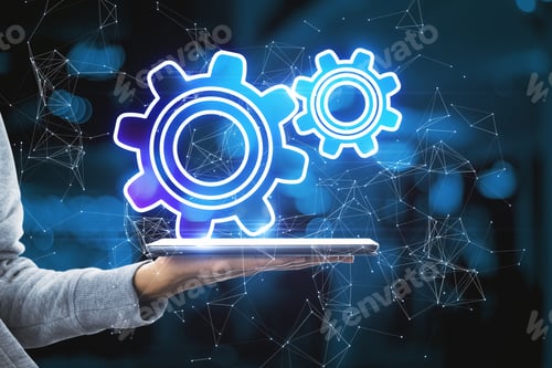 Preview: Close Up Of Hand Holding Tablet With Abstract Glowing Gear Wheels On Blurry Bokeh Background With