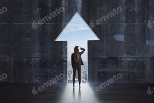 Preview: Back View Of Young Businesswoman In Concrete Interior With Arrow Opening. Growth And Research