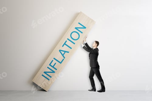 Preview: Attractive Young European Businessman Stopping Wooden Block With Crisis, Depression And Inflation