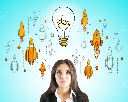 Preview: Attractive Thoughtful Young Businesswoman Portrait With Creative Startup Sketch With Drawn Rockets