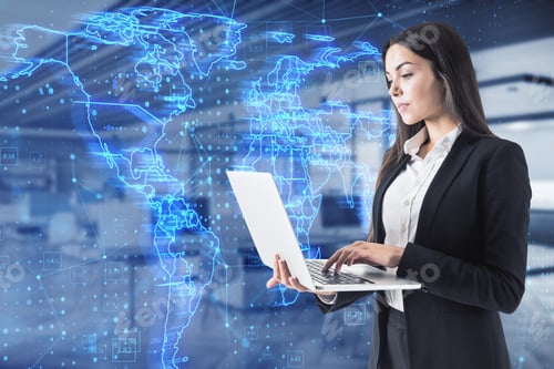 Preview: Attractive Young European Businesswoman Using Laptop With Glowing Blue Map Hud Screen And Digital