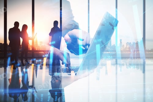Preview: Abstract Image Of Businessman Using Laptop In Modern Office Interior With Glowing Forex Graph