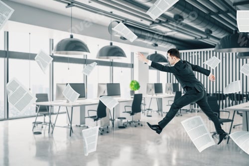 Preview: Young Businessman Jumping In Contemporary Concrete Office Interior With City View. Management And