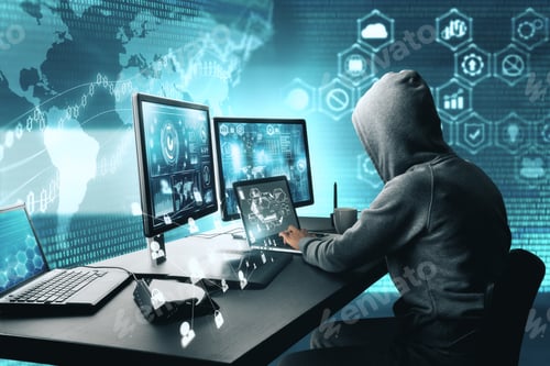 Preview: Side View Of Hacker Using Computer With Digital Interface While Sitting At Desk Of Blurry Interior