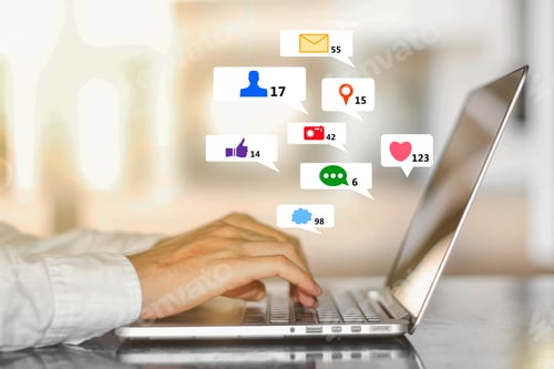 Preview: Close Up Of Businessman Hands At Desk Using Laptop With Creative Social Media Icons On Abstract